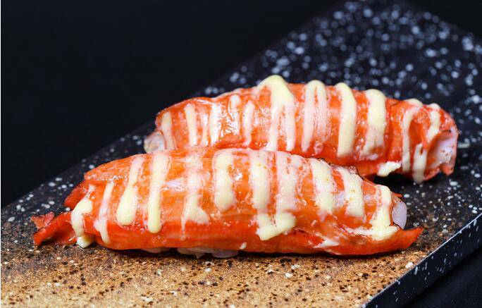 High definition picture of Hokkaido crab stick sushi grilled by fire