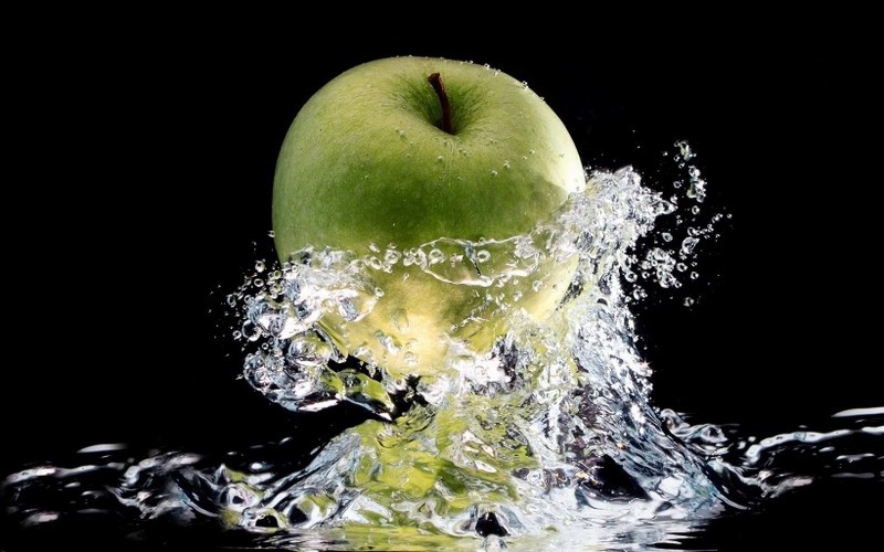 Picture of fruits falling into the water