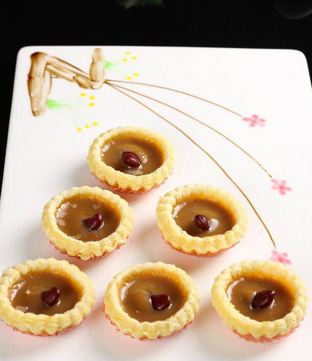 Picture of homemade red bean egg tarts in an oven