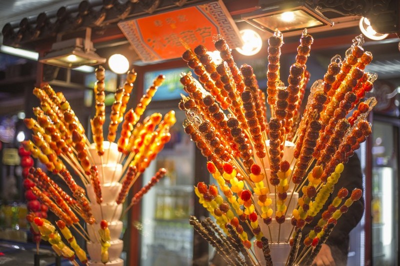 Sweet and sour old Beijing snack Tomatoes on sticks pictures