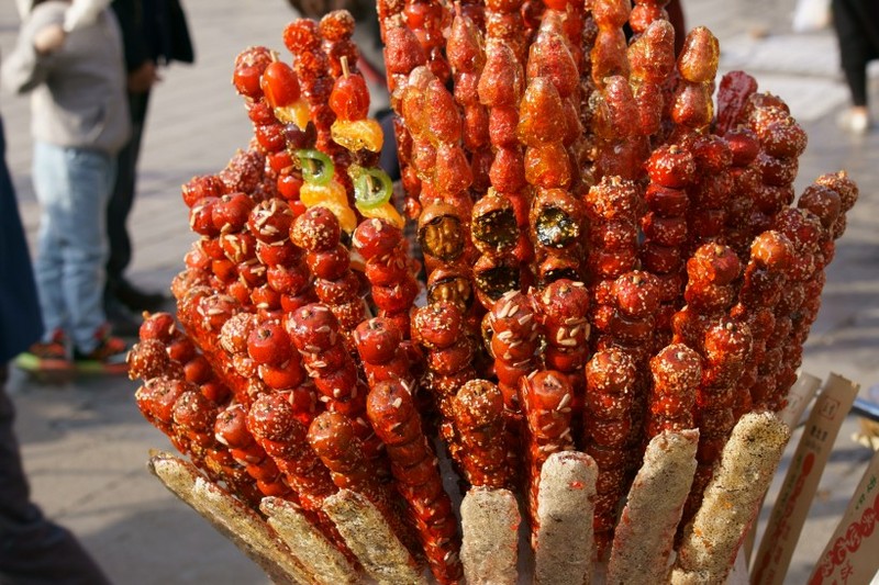 Sweet and sour old Beijing snack Tomatoes on sticks pictures