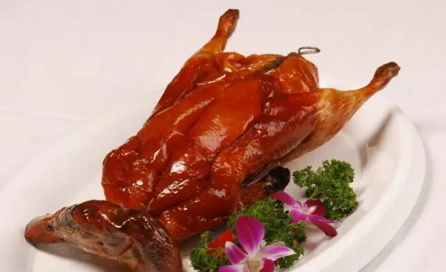 A group of pictures of a whole roasted duck that looks so tempting to eat