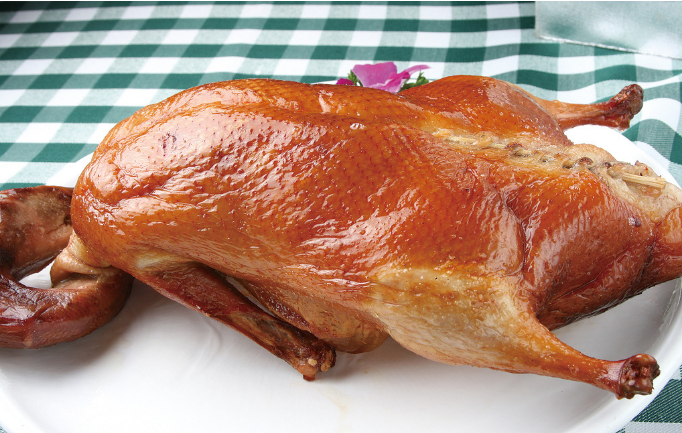 A group of pictures of a whole roasted duck that looks so tempting to eat