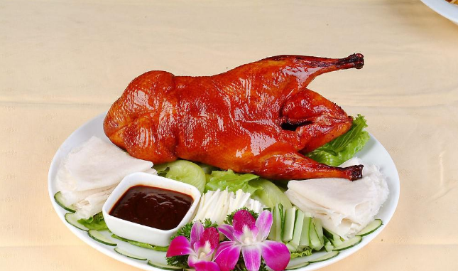 A group of pictures of a whole roasted duck that looks so tempting to eat