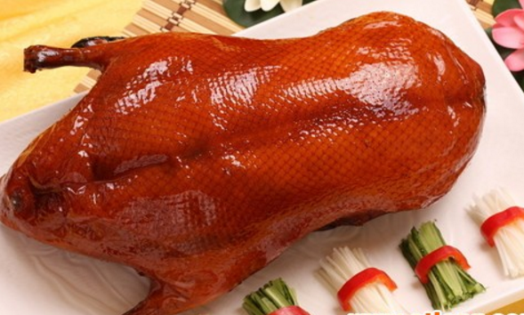 A group of pictures of a whole roasted duck that looks so tempting to eat