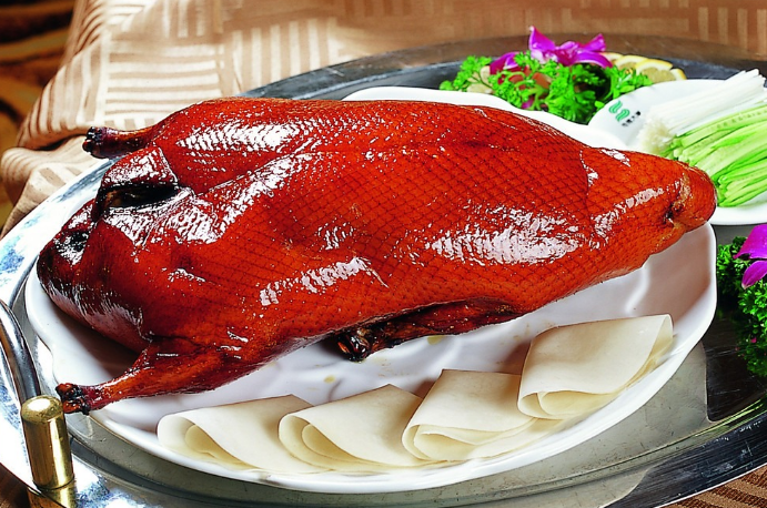 A group of pictures of a whole roasted duck that looks so tempting to eat