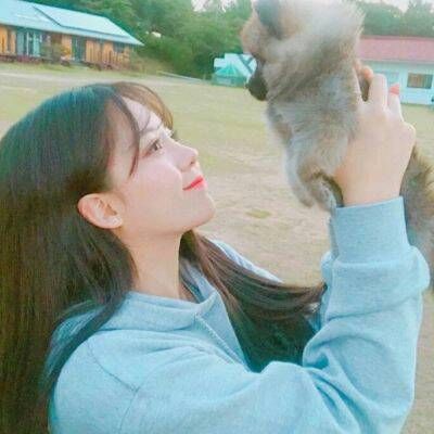 A cute portrait of a sweet girl holding a pet and a cute girl who loves small animals