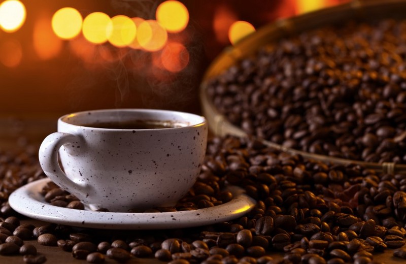 A picture of strong aroma coffee and small coffee beans