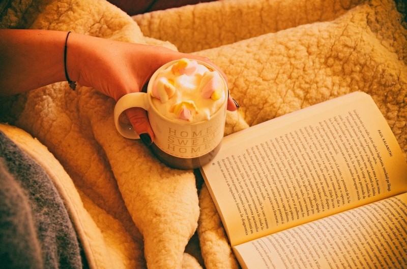 Picture of enjoying afternoon tea while reading a book