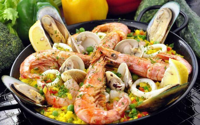 A picture of Spanish seafood rice with a perfect combination of color, aroma, and flavor
