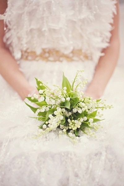 A beautiful picture of a girl holding flowers in front of you