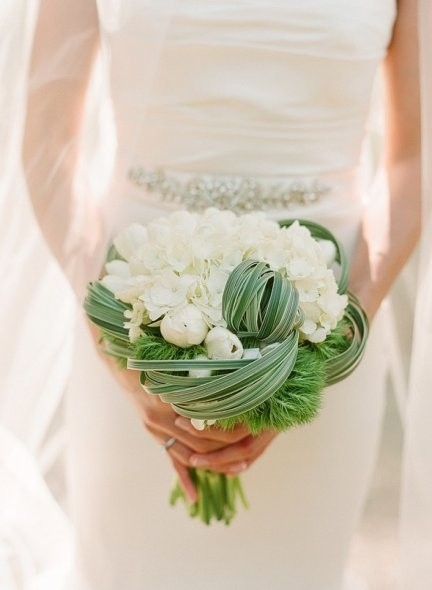 A beautiful picture of a girl holding flowers in front of you