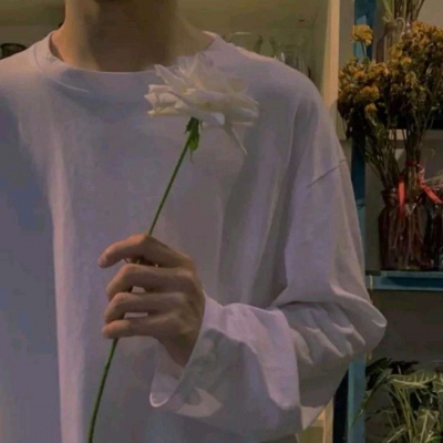 HD picture of a relatively literary half-length man's head holding flowers