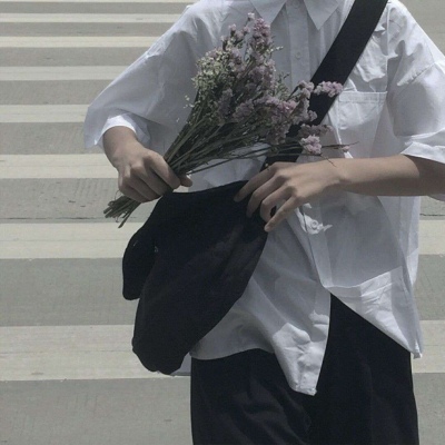 HD picture of a relatively literary half-length man's head holding flowers