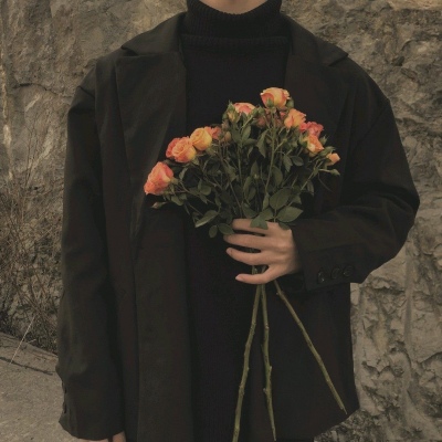 HD picture of a relatively literary half-length man's head holding flowers