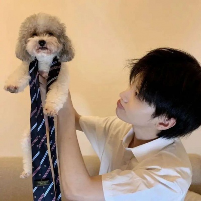 Super clear picture of a handsome man holding a pet