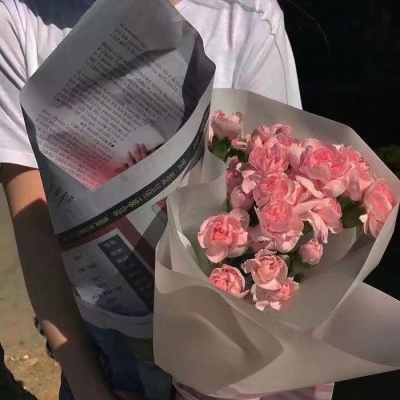 Male head holding flowers in hand