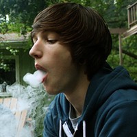 Picture of a decadent boy spitting smoke avatar