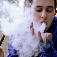 Picture of a decadent boy spitting smoke avatar