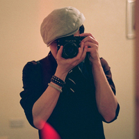 Good-looking boy taking a picture with camera