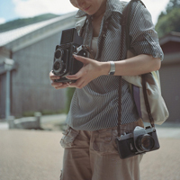 Good-looking boy taking a picture with camera