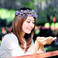 Fresh avatar picture of a girl wearing flowers on her head