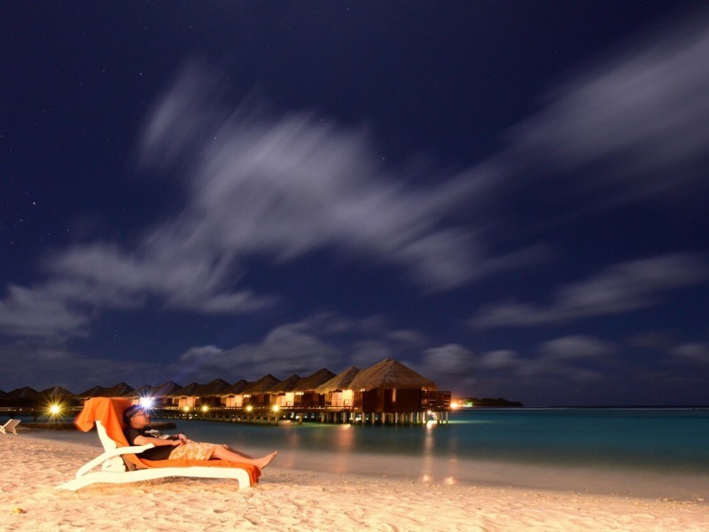 A collection of pictures of the beautiful night view of Full Moon Island in the Maldives