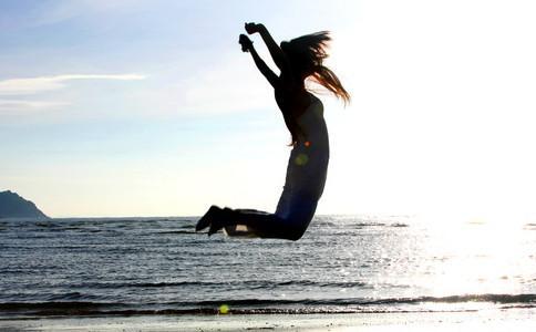 Beautiful pictures of jumping on the beach. Happiness is dancing in the wind in a white wedding dress.