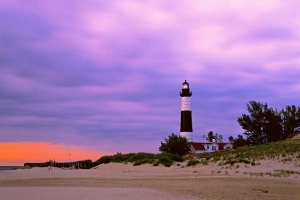 Beautiful scenery pictures of lighthouse guarding ships