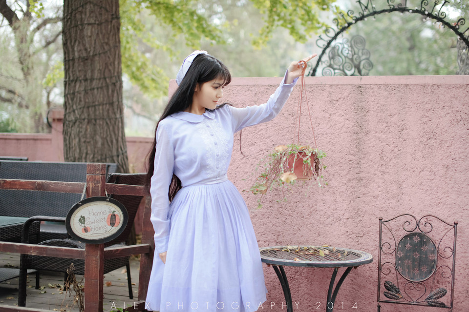 Beautiful personal photo of a girl in a fresh purple dress