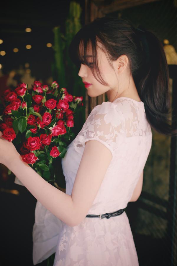 Beautiful girl holding roses photo